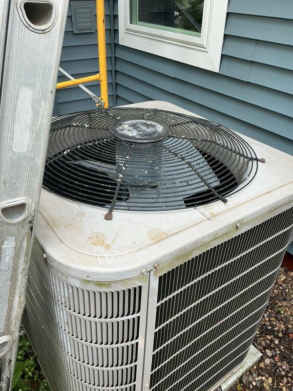 Completed scheduled air conditioning tune-up and preventive maintenance on residential cooling system. Performed comprehensive inspection of outdoor condenser units, verified proper operation of compressor and fan motors, and documented equipment condition with photos showing units in good working order with normal weathering for outdoor equipment.
