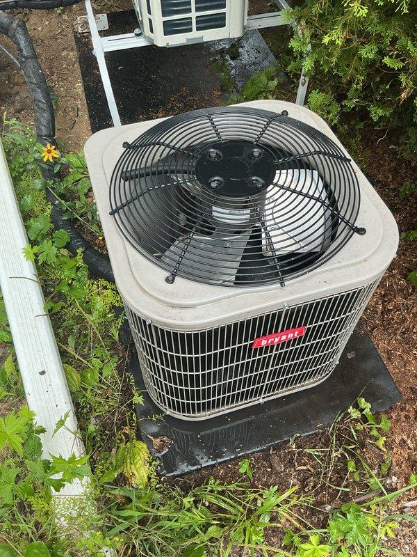 Completed scheduled air conditioning tune-up and preventive maintenance on Bryant outdoor condensing unit. System inspected, tested, and confirmed operating properly in cooling mode. Unit found in good overall condition with adequate clearances, though minor vegetation growth noted around base perimeter.