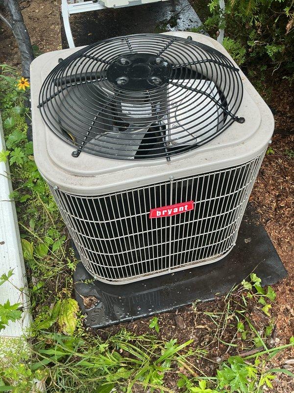 Completed scheduled air conditioning tune-up and preventive maintenance on Bryant outdoor condensing unit. System inspected, tested, and confirmed operating properly in cooling mode. Unit found in good overall condition with adequate clearances, though minor vegetation growth noted around base perimeter.