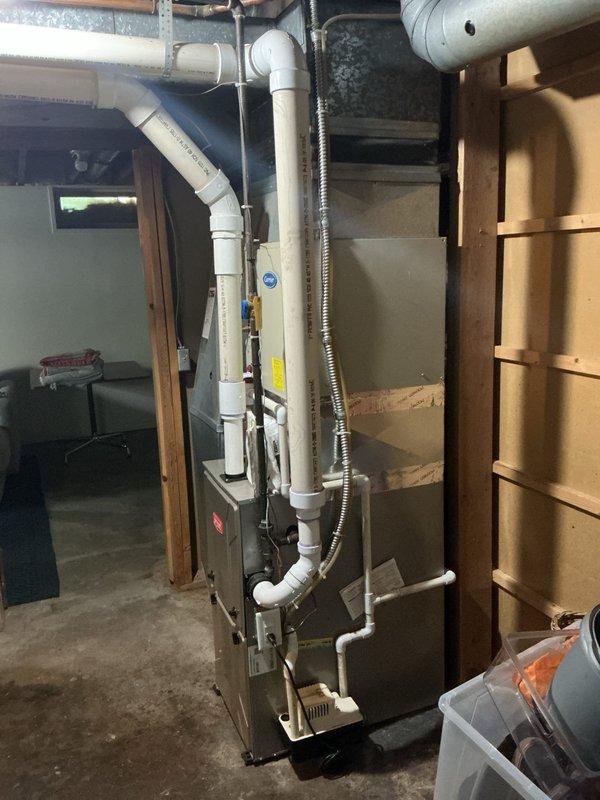 Responded to no cooling complaint with evaporator coil freezing issue at residential property. Upon inspection, diagnosed frozen coil condition preventing proper cooling operation. Evaluated furnace/air handler installation and electrical connections at breaker panel to identify root cause of freezing condition, which typically indicates restricted airflow, low refrigerant charge, or system malfunction requiring further repair work.