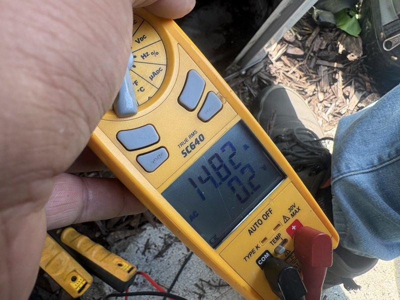 Completed comprehensive AC tune-up on outdoor condenser unit. Performed system diagnostics using digital multimeter to verify electrical readings and operational parameters. All measurements within manufacturer specifications, unit operating efficiently with proper airflow through top-mounted fan assembly.