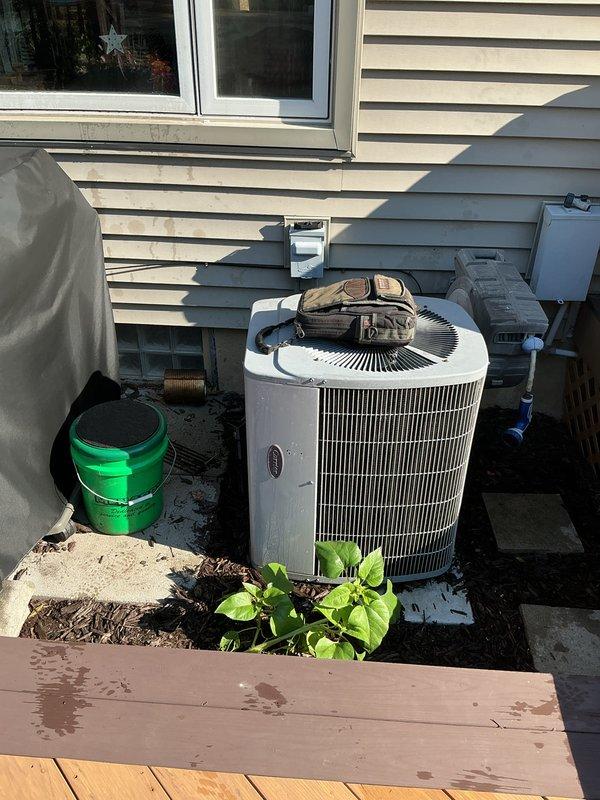 Completed comprehensive AC tune-up on outdoor condenser unit. Performed system diagnostics using digital multimeter to verify electrical readings and operational parameters. All measurements within manufacturer specifications, unit operating efficiently with proper airflow through top-mounted fan assembly.