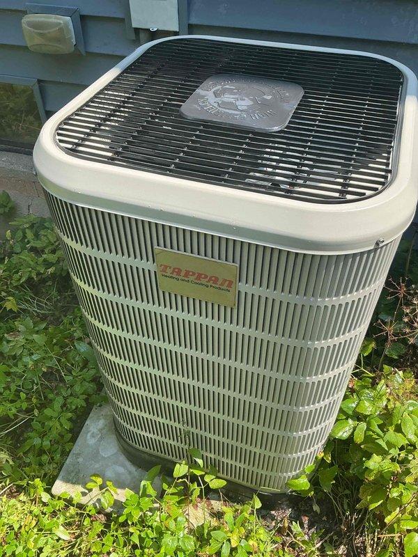 Completed scheduled air conditioning tune-up and preventive maintenance on residential cooling system. Inspected outdoor condensing unit, verified proper operation of all components, and documented equipment condition with photos showing unit in good working order with normal weathering for age.