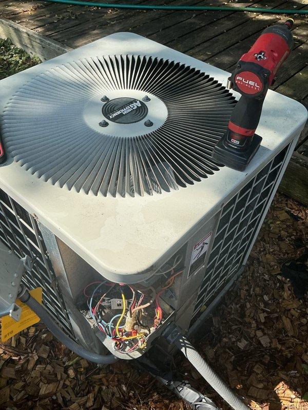 Completed scheduled preventive maintenance on residential air conditioning system. Performed thorough inspection of outdoor condenser unit, which revealed heavily contaminated condenser coils with significant dirt, debris, and organic matter accumulation affecting heat transfer efficiency. Cleaned condenser coils and removed accumulated leaves and debris from base of unit and surrounding area. Inspected electrical components, contactors, and wiring connections inside condenser cabinet. Verified system operation and confirmed unit returned to proper cooling function. Discussed potential thermostat upgrade options with customer for future consideration.