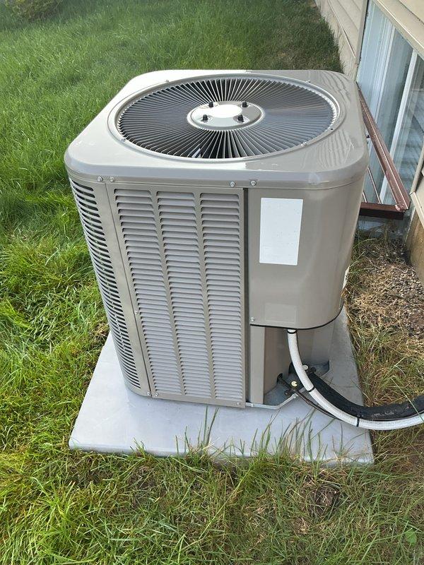 Completed scheduled air conditioning tune-up and preventive maintenance on residential cooling system. Performed comprehensive inspection of outdoor condenser unit, confirmed proper operation of compressor and condenser fan motor, verified adequate airflow through coil louvers, and documented equipment condition with unit showing good overall maintenance and no visible signs of damage or deterioration. System operating within normal parameters with refrigerant lines properly secured and unit maintaining appropriate clearances on concrete pad foundation.