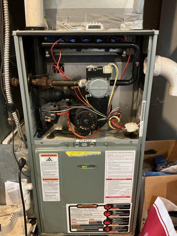 Performed routine maintenance and cleaning on Ruud Achiever 90 Plus furnace system. Removed access panel and inspected internal components including blower motor assembly, gas valve, pressure switches, and ignition system. Cleaned blower wheel and housing, verified all electrical connections and wire terminals secure, and inspected heat exchanger for signs of deterioration or carbon buildup. Checked gas valve operation, pressure switch functionality, and condensate drainage system. Verified proper venting configuration with PVC piping and confirmed all safety labels and warning stickers present and legible. Completed required municipal inspection documentation. Unit tested and operating within manufacturer specifications upon completion.