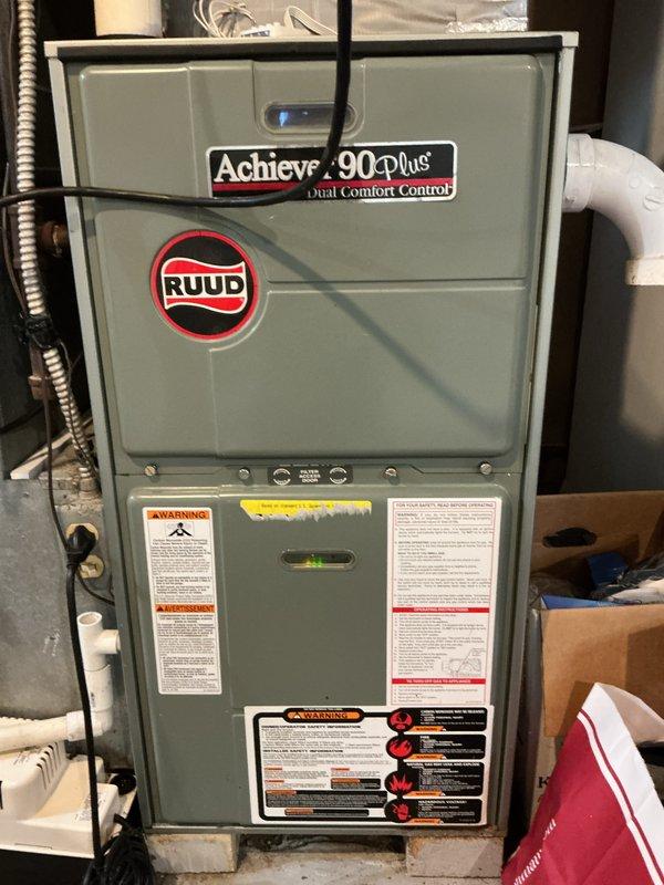 Performed routine maintenance and cleaning on Ruud Achiever 90 Plus furnace system. Removed access panel and inspected internal components including blower motor assembly, gas valve, pressure switches, and ignition system. Cleaned blower wheel and housing, verified all electrical connections and wire terminals secure, and inspected heat exchanger for signs of deterioration or carbon buildup. Checked gas valve operation, pressure switch functionality, and condensate drainage system. Verified proper venting configuration with PVC piping and confirmed all safety labels and warning stickers present and legible. Completed required municipal inspection documentation. Unit tested and operating within manufacturer specifications upon completion.