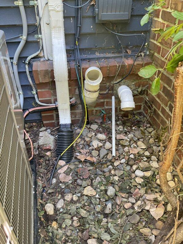 Completed full HVAC system replacement including air conditioning unit, evaporator coil, and refrigerant lineset in exterior utility area between building structures. All new equipment installed with complete manufacturer warranty coverage and system tested for proper operation.