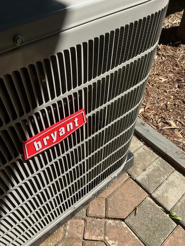 Completed scheduled post-installation tune-up on Bryant outdoor condensing unit. Performed comprehensive system evaluation, verified proper operation of all components, confirmed refrigerant levels and electrical connections, and documented unit condition with exterior photos showing equipment in good working order on concrete paver pad.