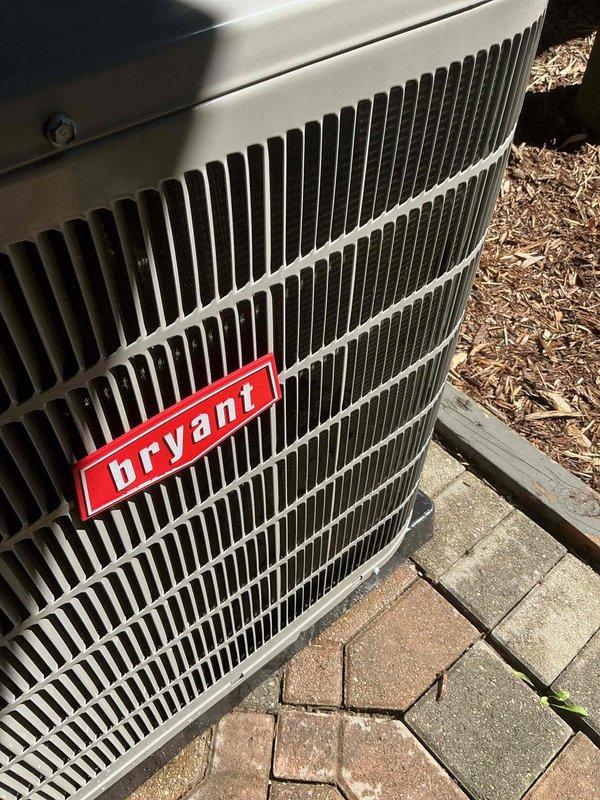 Completed scheduled post-installation tune-up on Bryant outdoor condensing unit. Performed comprehensive system evaluation, verified proper operation of all components, confirmed refrigerant levels and electrical connections, and documented unit condition with exterior photos showing equipment in good working order on concrete paver pad.