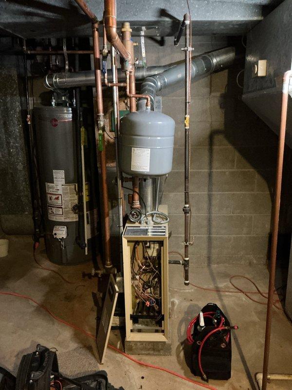 Completed comprehensive AC tune-up and maintenance service on multi-zone ductless mini-split system with two indoor head units. Performed standard preventative maintenance procedures including filter inspection and cleaning, coil evaluation, condensate drain verification, and refrigerant pressure checks. Inspected basement mechanical room housing boiler system, water heater, and associated copper piping infrastructure. All equipment found operating within normal parameters with no deficiencies noted. System tested and confirmed functioning properly upon completion of service.