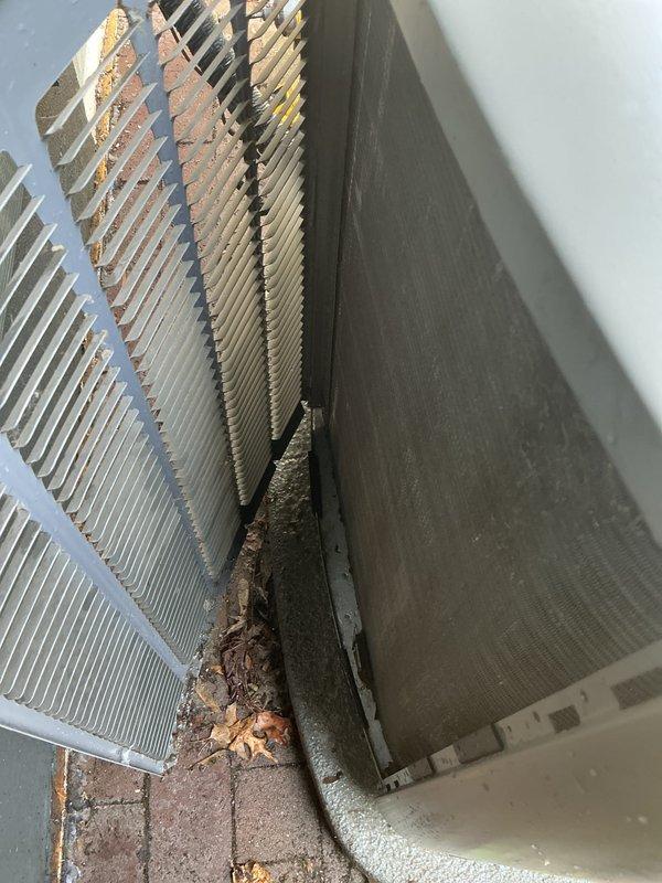 Completed comprehensive AC tune-up and maintenance service on 4-year-old Lennox unit with warranty through July 2027. Inspected condenser coils and found significant accumulation of leaves, organic debris, and dirt lodged between fins and at base of unit. Cleaned condenser coils to restore proper airflow and heat transfer efficiency, removed all debris from unit perimeter and concrete pad. Performed standard preventative maintenance checks including refrigerant line inspection, drainage line verification, and overall system operational testing. System confirmed working properly upon completion with improved airflow through heat exchanger fins.