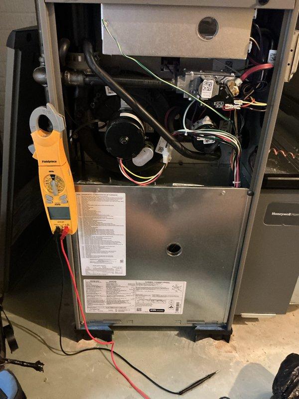 Performed comprehensive tune-up and preventive maintenance on 2024 gas furnace unit. Conducted thorough system inspection with access panel removed, tested electrical components and connections using digital multimeter, verified blower motor operation, and measured system parameters with diagnostic equipment. All components found operating within manufacturer specifications; unit running efficiently with no issues identified.