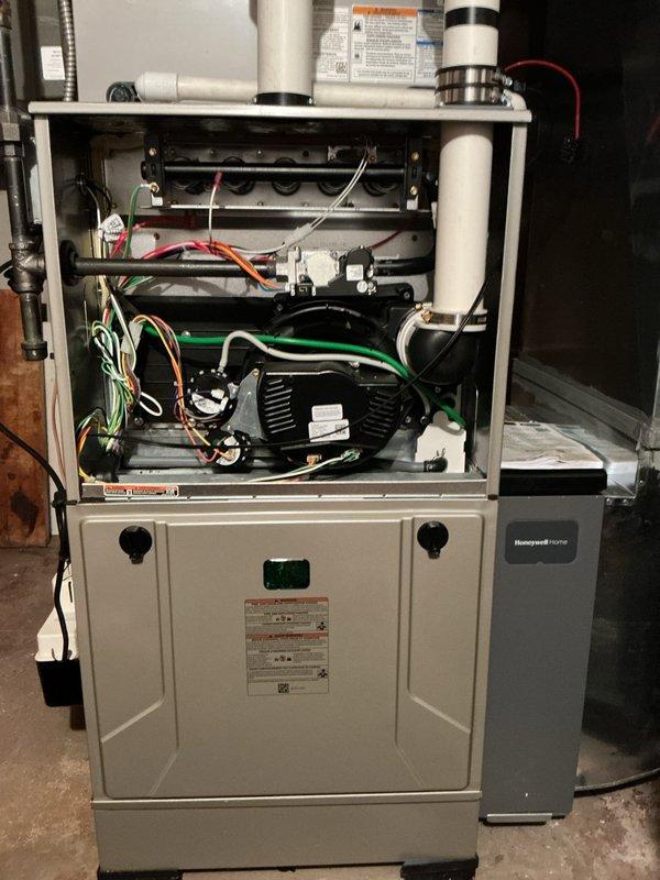 Completed comprehensive tune-up and preventative maintenance on residential multi-zone HVAC system including air conditioning unit and gas furnace. Performed full inspection of gas furnace internal components, verified proper burner ignition and flame characteristics showing optimal blue flame pattern, tested blower motor assembly operation, inspected electrical connections and wiring throughout unit, and confirmed proper venting through PVC intake/exhaust piping. Evaluated heat exchanger condition, control board functionality, and safety mechanisms. Processed membership renewal for continued service coverage.