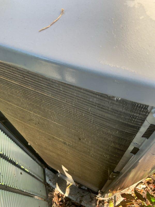 # HVAC Maintenance - PTU/ESA/AC

Completed scheduled preventive maintenance on residential air conditioning system during assigned service window. Performed comprehensive inspection of outdoor condensing unit, documenting condition of heat exchanger coils which showed moderate accumulation of dirt and debris on fin surfaces. Noted organic material and dried leaves collected at base of unit. Evaluated filter components and mesh screening for airflow restriction. System operational upon completion of maintenance protocol. Collected payment for recurring membership service agreement.