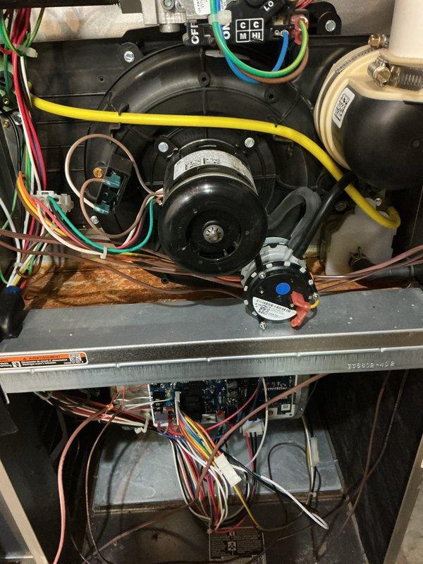 Completed yearly preventative maintenance on 4-year-old gas furnace and air conditioning system. Performed comprehensive tune-up including inspection of blower motor assembly, electrical connections, and control board within furnace cabinet; verified all wiring terminals secure and operational. Inspected outdoor condenser unit, cleaned debris from louver grille, confirmed proper mounting and airflow clearance around equipment.