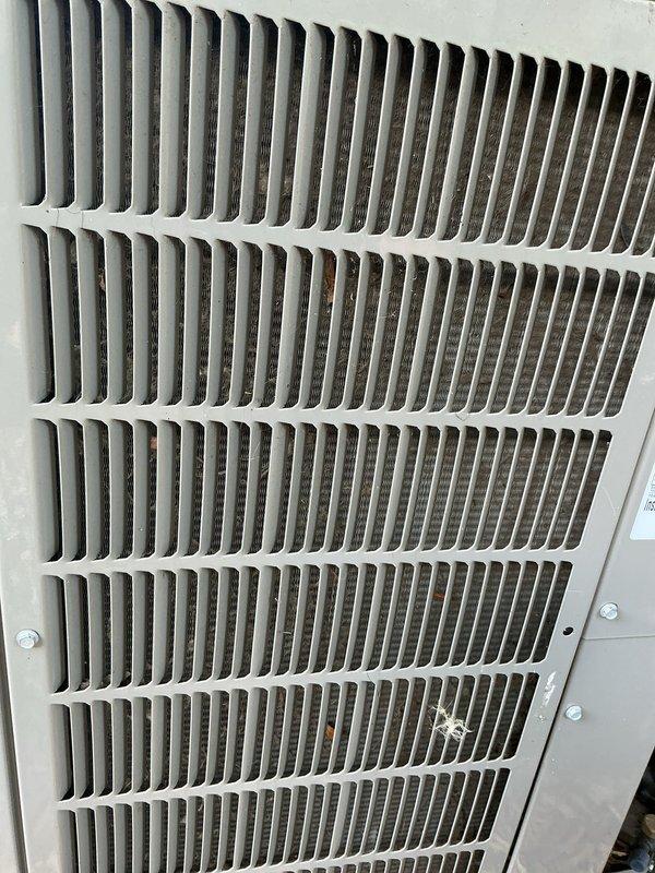 Completed comprehensive tune-up and preventive maintenance on multi-system HVAC unit including air conditioning and gas furnace components. Performed thorough inspection of furnace interior, gas valve assembly, heat exchanger, blower motor, electrical connections, and ductwork, verifying all components operating within manufacturer specifications. Documented equipment condition with photos showing internal components and air return grille requiring routine cleaning.