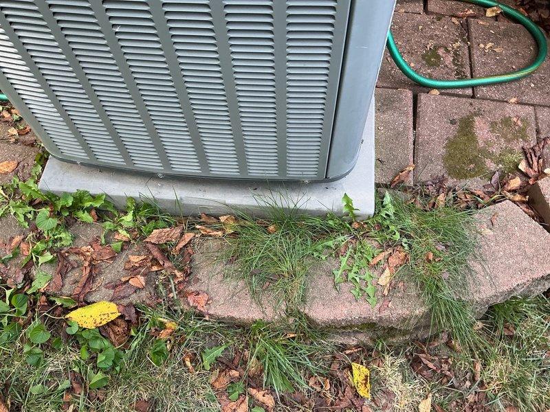 Conducted comprehensive on-site evaluation for complete HVAC system replacement at residential property. Assessed existing outdoor condensing unit located on concrete pad in side yard area, documenting current equipment condition and installation configuration. Evaluated exterior electrical service connection mounted on brick wall, including weatherproofed conduit routing and utility hookup specifications. Documented site conditions including equipment placement, clearances, existing concrete pad foundation, electrical infrastructure, and accessibility for full system replacement installation.