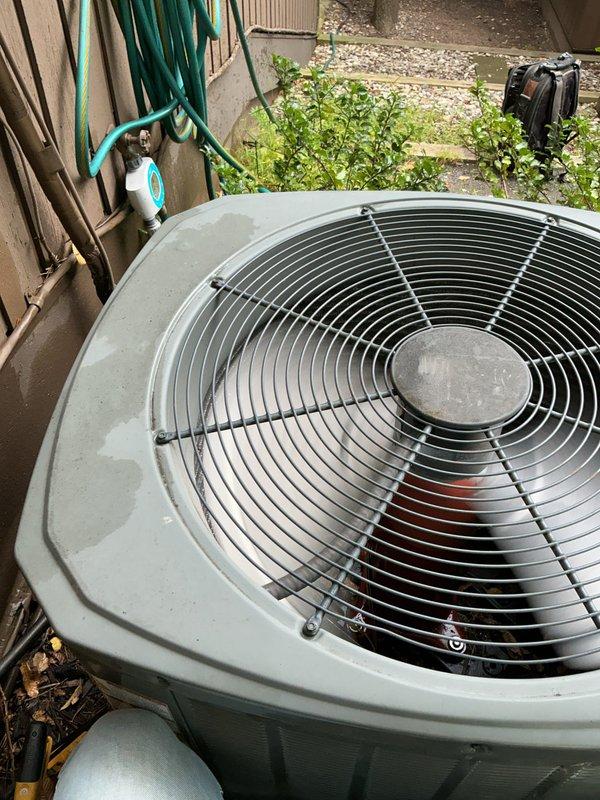 Completed scheduled AC tune-up on Trane outdoor condensing unit. Performed comprehensive preventive maintenance inspection, verified system operation in cooling mode, and documented equipment condition with photos showing unit properly positioned on pad with adequate clearance and vegetation management around perimeter.