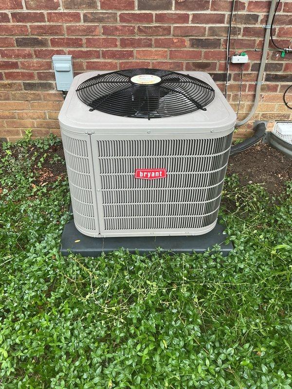 Completed routine maintenance on a 5-year-old Bryant air conditioning system and furnace with no reported issues. Performed comprehensive AC tune-up including inspection of outdoor condensing unit, verified proper operation of condenser fan and motor, checked refrigerant levels and system pressures, cleaned condenser coils, inspected electrical connections and contactors, and tested capacitor performance. Examined furnace components in basement including heat exchanger, blower motor, gas valve, ignition system, and air filter. Verified proper airflow through both systems, checked thermostat calibration and operation, inspected condensate drain lines and PVC piping for blockages, and confirmed electrical disconnect switch functionality. All components operating within manufacturer specifications with no immediate repairs required. Documented unit condition with photographs showing outdoor condenser positioned on concrete pad with proper clearance, though minor vegetation growth noted ar