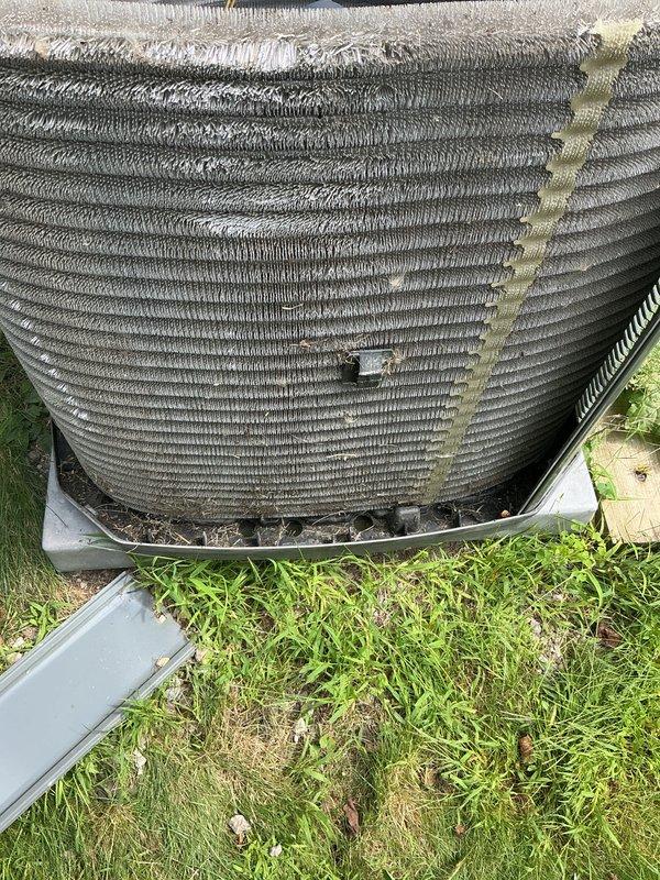 Performed routine maintenance on residential cooling system. Inspected outdoor condenser unit and confirmed operational status, noting minor insulation deterioration at top of unit. Cleaned and evaluated air handler grille, removing dust accumulation from louvers and ventilation openings to ensure proper airflow throughout the system.