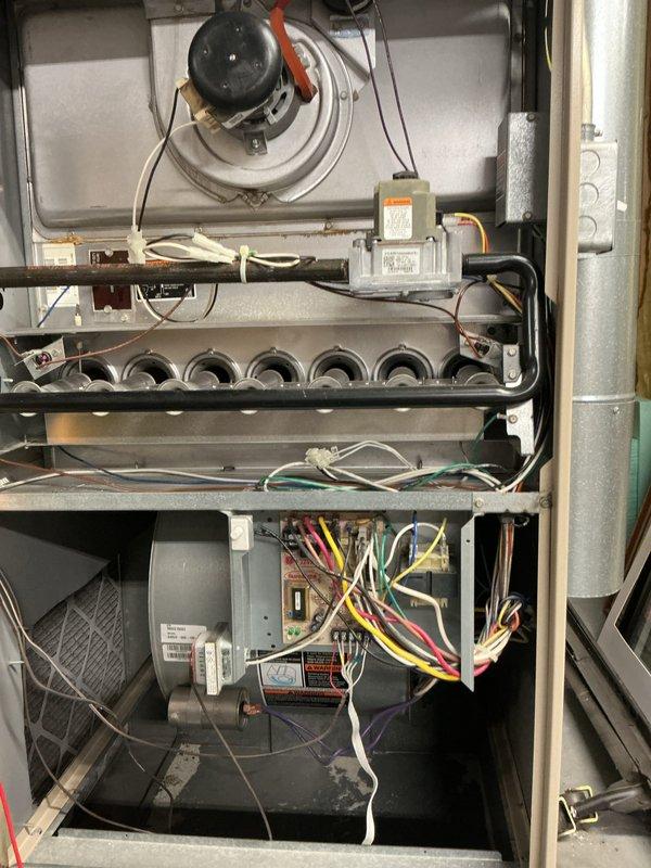 Completed comprehensive tune-up on gas furnace and air conditioning system. Performed full inspection of furnace components including draft inducer motor, burner assembly, gas valve, blower motor, and control board with all components found operating within manufacturer specifications. Conducted electrical testing with multimeter to verify proper voltage and amperage readings across all system connections.