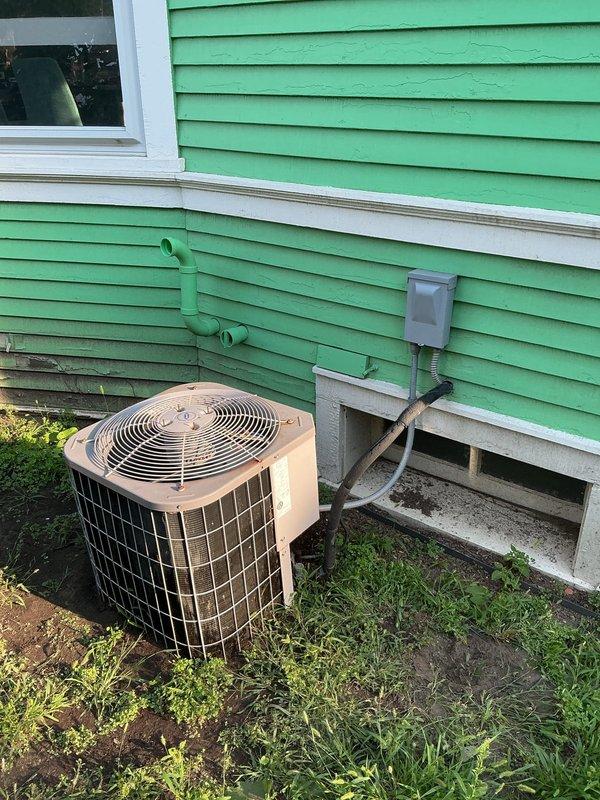 Responded to no-cooling complaint on older residential air conditioning system at rental property. Upon arrival, confirmed unit was running and moving air but not producing cooling. Performed visual inspection of outdoor condenser unit and electrical components. Documented existing equipment condition including outdoor condensing unit, electrical disconnect, and circuit breaker panel. Identified system deficiencies consistent with age and wear of equipment. Provided estimate for new system replacement as requested. Owner contact made regarding findings and repair options.