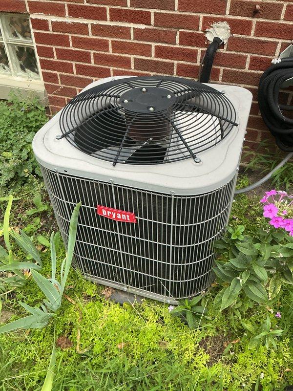 Completed scheduled cooling season tune-up and preventive maintenance on Bryant brand outdoor condensing unit. Performed comprehensive system inspection, verified proper operation of all components, and documented equipment condition with photographs showing unit in functional status with adequate clearances from surrounding landscaping.