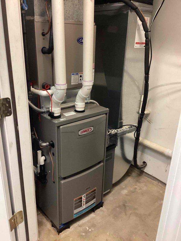 Completed gas furnace tuneup and investigated customer complaint of inadequate heating and cooling to upstairs room. Performed standard maintenance protocol including inspection of Lennox furnace system, verified proper operation of all components, and examined ductwork distribution. Documented equipment condition with photos showing furnace, control panel, venting system, and associated HVAC infrastructure in basement mechanical room.