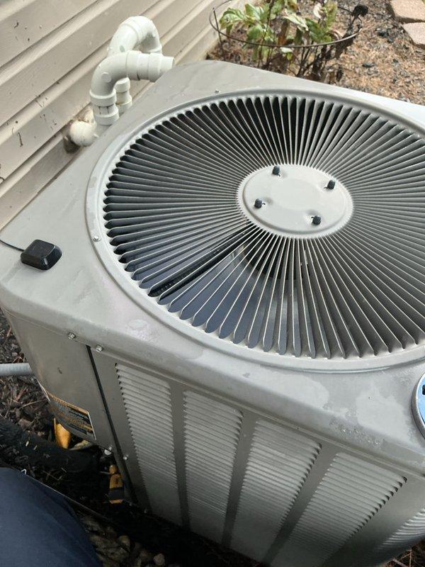 Completed scheduled air conditioning tune-up on Lennox condensing unit. Performed comprehensive maintenance inspection, verified system operation in cooling mode, and documented unit condition with exterior photos showing proper installation and adequate clearance from landscaping.
