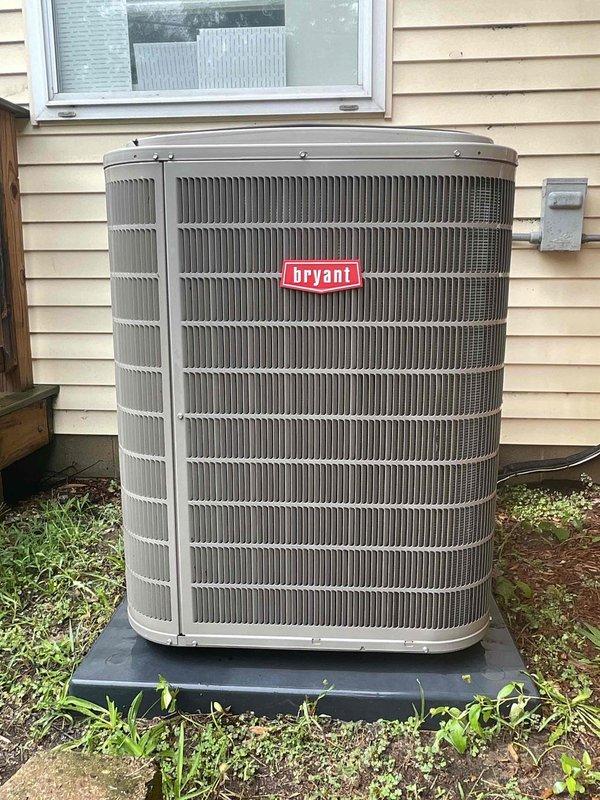 Completed scheduled air conditioning tune-up on Bryant brand outdoor condensing unit. Performed comprehensive system inspection, verified unit operation, and documented equipment condition with photos showing unit in normal working order with typical weathering on exterior components.