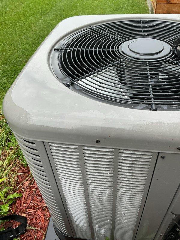 Completed comprehensive air conditioning tune-up on residential outdoor condenser unit. Performed standard preventative maintenance inspection, verified proper operation of fan motor and compressor, checked refrigerant lines for leaks, and confirmed unit is functioning within normal parameters for optimal cooling efficiency.