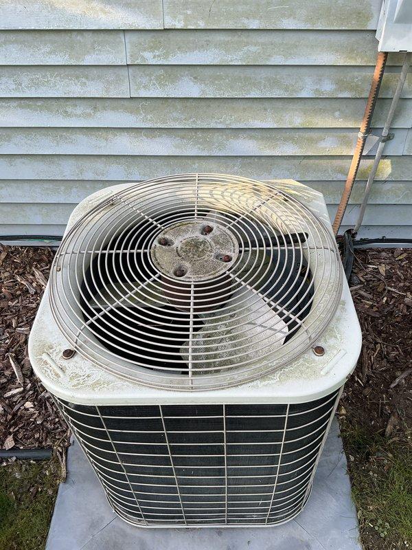Completed scheduled preventive maintenance on residential air conditioning system. Performed comprehensive inspection of outdoor condenser unit, verified proper operation of fan assembly and motor, checked refrigerant lines for leaks and proper insulation, and confirmed unit was level on concrete pad. Cleaned accumulated debris from fan guard and exterior housing to ensure optimal airflow and system efficiency.