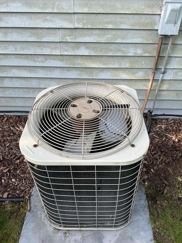Completed scheduled preventive maintenance on residential air conditioning system. Inspected outdoor condenser units, verified proper operation of fan assemblies and protective guards, confirmed adequate clearance from surrounding vegetation and building structure, and ensured units were properly positioned on concrete pads with appropriate drainage. All equipment found operating within normal parameters with no immediate service needs identified.