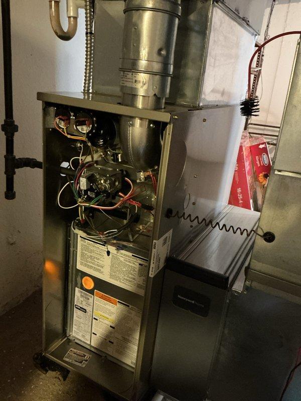 Completed comprehensive preventive maintenance tune-up on 4-year-old Bryant gas furnace system. Performed full inspection of burner assembly, heat exchanger, gas valve operation, and all internal electrical components with access panel opened for thorough examination. Verified proper venting, condensate drain functionality, and ductwork connections. All system components operating within manufacturer specifications and unit ready for upcoming heating season.
