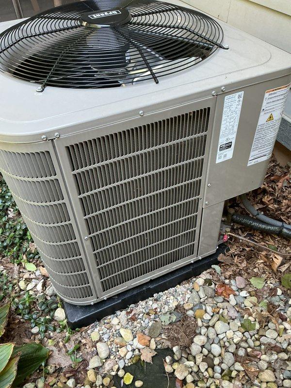 Performed scheduled preventive maintenance on residential outdoor air conditioning condenser unit. Inspected unit exterior, verified proper mounting on pad, checked condenser coils through protective grilles for cleanliness and airflow obstruction. Confirmed fan assembly operation and protective guards securely in place. Unit found in good working condition with no visible signs of damage, rust, or deterioration, indicating proper system performance and regular maintenance compliance.