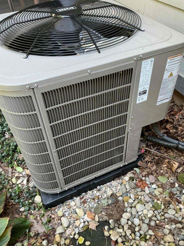 Performed scheduled preventive maintenance on residential outdoor air conditioning condenser unit. Inspected unit exterior, verified proper mounting on pad, checked condenser coils through protective grilles for cleanliness and airflow obstruction. Confirmed fan assembly operation and protective guards securely in place. Unit found in good working condition with no visible signs of damage, rust, or deterioration, indicating proper system performance and regular maintenance compliance.