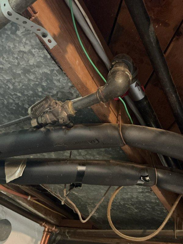 Responded to gas leak marked by utility company at residential property. Upon inspection, located leak at gas pipe connection in basement utility area. Tightened connection fitting and verified seal integrity to resolve leak condition.