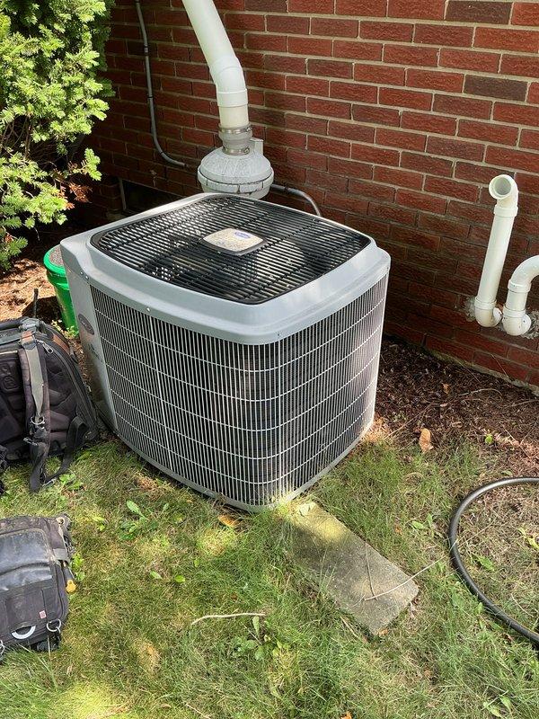 Completed comprehensive air conditioning tune-up on residential outdoor condensing unit. Performed standard maintenance protocol including inspection of condenser coil, refrigerant lines, electrical connections, and fan assembly; verified proper operation of all components and documented equipment condition with photographs.