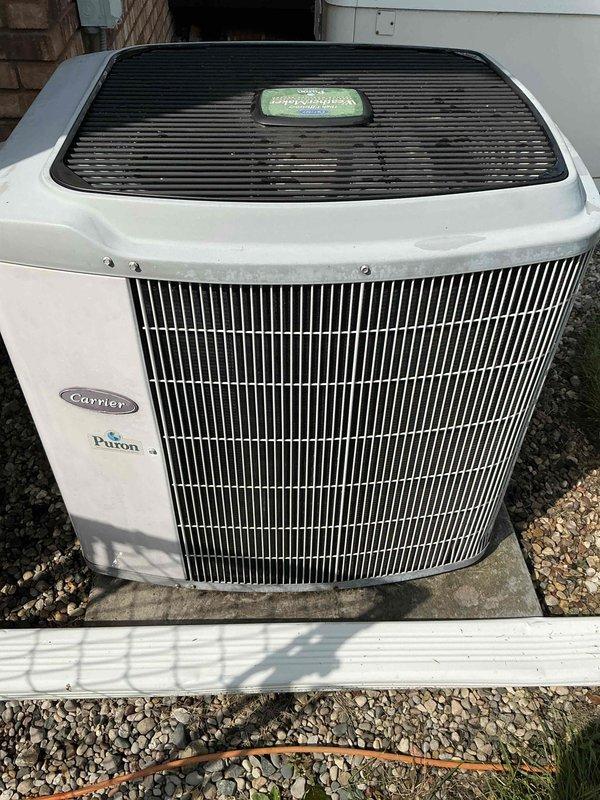 Performed scheduled general maintenance on Carrier air conditioning system with Puron refrigerant. Inspected outdoor condensing unit, verified proper operation of condenser coil and protective components, and confirmed unit integrity with no visible damage or deterioration noted. System operational and functioning within normal parameters upon completion.