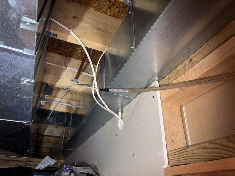 Responded to service call for condensate pump leak and unit not cooling. Upon inspection, found condensate drainage system issue at air handler located in basement utility area. Addressed leaking condensate pump, verified proper drainage through PVC trap assembly, and checked air filter condition. System tested and returned to normal cooling operation with no active leaks present at time of departure.