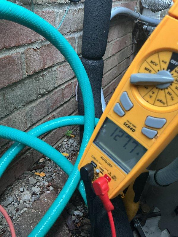 Completed scheduled AC tune-up on residential outdoor condensing unit. Performed comprehensive system inspection, tested electrical components with multimeter confirming proper voltage readings, cleaned condenser coils, and verified proper airflow through unit venting. All components operating within normal parameters with no deficiencies noted.