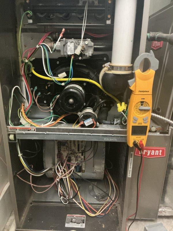 Completed comprehensive gas furnace tune-up on Bryant HVAC unit at rental property. Performed full system inspection including electrical diagnostics with clamp meter, checked gas valve operation, inspected blower motor assembly, verified all wire connections, and tested control board functionality. Provided and installed air filters on-site as requested, with second unit tune-up performed at companion rental property per customer's coordination request.