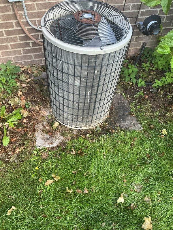 Completed comprehensive AC tune-up on residential outdoor condensing unit. Performed standard maintenance procedures including inspection of refrigerant lines, electrical disconnect, fan operation, and overall system condition. Unit found to be in functional operating condition with normal outdoor weathering present.