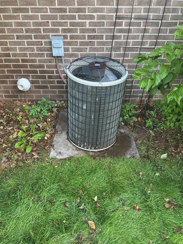 Completed comprehensive AC tune-up on residential outdoor condensing unit. Performed standard maintenance procedures including inspection of refrigerant lines, electrical disconnect, fan operation, and overall system condition. Unit found to be in functional operating condition with normal outdoor weathering present.