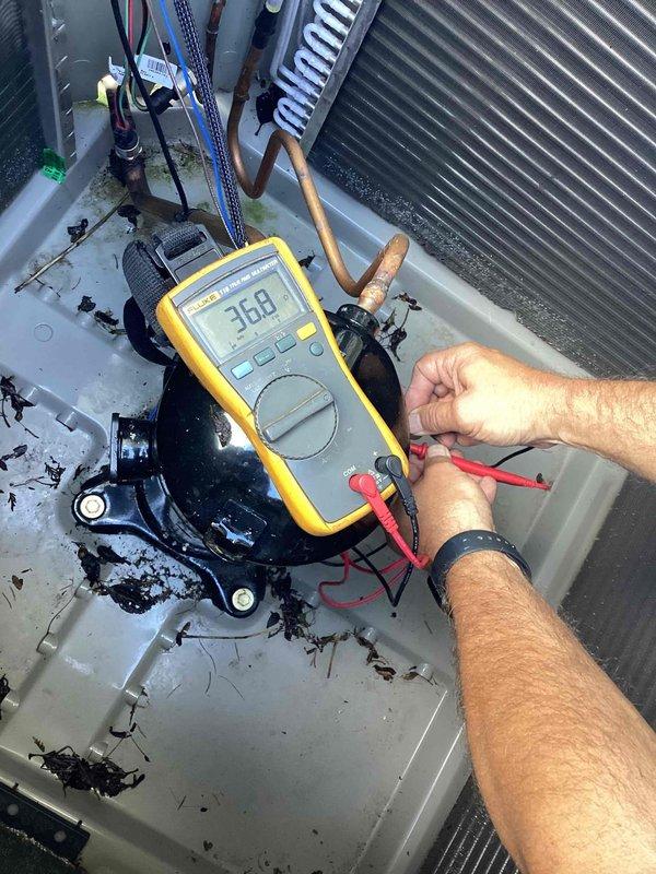 Completed full warranty replacement of Bryant air conditioning unit at residential property. Removed failed existing system and installed new Bryant AC unit on concrete pad against exterior wall. Positioned unit with proper clearances from building siding and vegetation. Installed electrical disconnect box on exterior wall with appropriate conduit routing. Connected refrigerant lines with proper insulation on suction line. Performed startup procedures and verified system operation. Measured voltage at 36.8V during diagnostic testing to confirm proper electrical connections. Inspected condenser fan operation and verified fan guard installation. System tested and operating within manufacturer specifications. Customer expressed satisfaction with completed warranty replacement. Unit left in full operational condition.