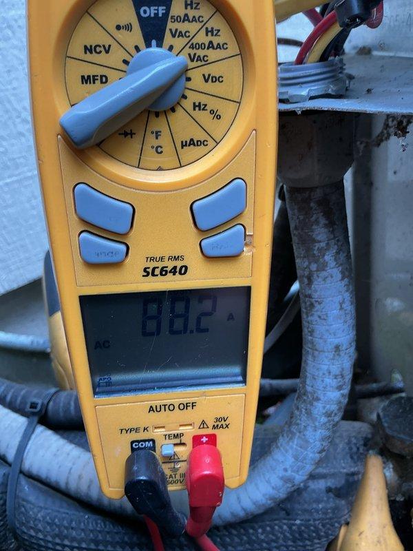 Completed comprehensive AC tune-up on residential split system. Performed electrical diagnostics using digital multimeter, verified capacitor reading of 80.2 MFD within manufacturer specifications, and inspected motor and compressor operation. Conducted visual inspection of outdoor condenser unit, confirmed proper fan operation, checked refrigerant levels, and verified all components functioning normally with no issues found.
