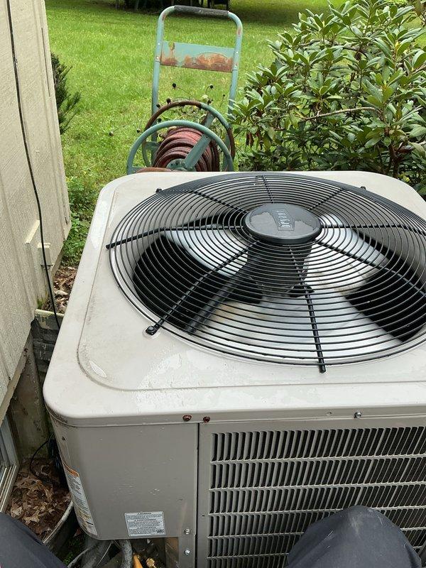 Completed comprehensive AC tune-up on residential split system. Performed electrical diagnostics using digital multimeter, verified capacitor reading of 80.2 MFD within manufacturer specifications, and inspected motor and compressor operation. Conducted visual inspection of outdoor condenser unit, confirmed proper fan operation, checked refrigerant levels, and verified all components functioning normally with no issues found.