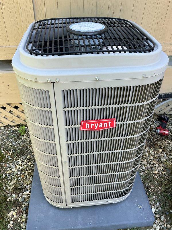 Completed scheduled maintenance on Bryant outdoor condensing unit. Performed standard cooling system inspection, verified operational status of unit positioned on concrete pad with proper gravel base and clearances. Unit found in working condition with normal outdoor weathering, no significant issues identified during recurring service visit.