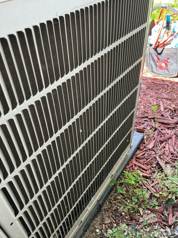 Performed comprehensive AC tune-up on residential outdoor condenser unit. Completed system inspection, verified proper operation of all components, and connected manifold gauges to check refrigerant pressures and system performance. Unit fins showed normal accumulation of outdoor debris but remained in functional condition with adequate airflow through the coil assembly.